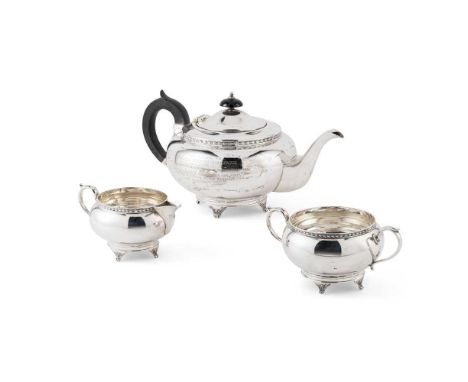 A 1930s three-piece tea-service  Viners, Sheffield 1932, comprising a teapot, twin-handled sugar basin, and a milk jug, all o