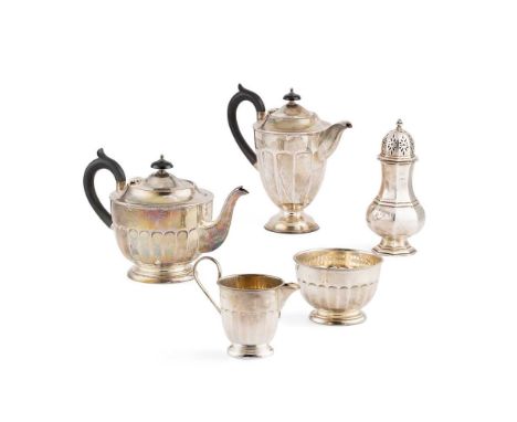 A matched four-piece tea-service  Viners, Sheffield 1931/2, comprising a hot water pot, a teapot milk jug and a sugar basin, 
