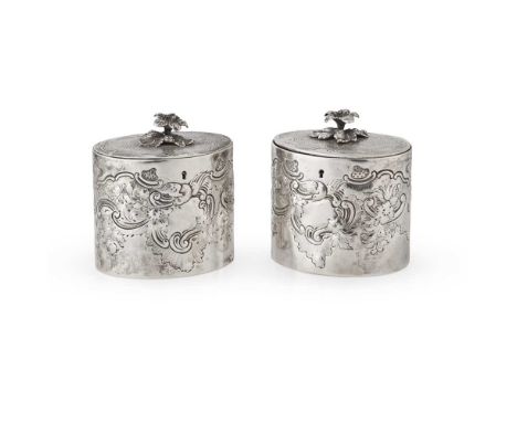 A pair of George III tea caddies Aldridge and Green, London 1780, of oval form, hinged cover with bold floral finial, chased 