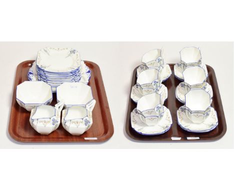 A Shelley Iris pattern tea set, Rd. 723404, comprising twelve cups &amp; saucers, twelve side plates, two sandwich plates, tw