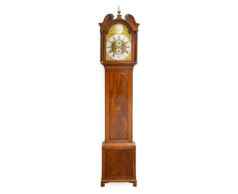 A Mahogany Eight Day Longcase Clock, swan neck pediment, arch flame mahogany trunk door, later 13-inch arch brass dial with a