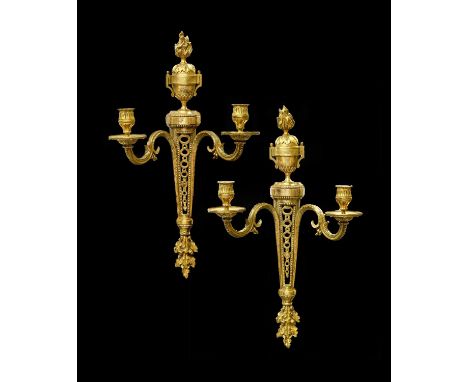 A Pair of 19th Century Gilt Brass Two Branch Wall Appliques, each with leaf cast nozzles and acanthus decoarated scrolled arm