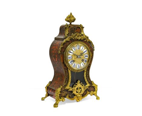 A French "Boulle" Striking Mantel Clock, circa 1900, the elaborate tortoiseshell veneered and brass inlaid "boulle" case surm