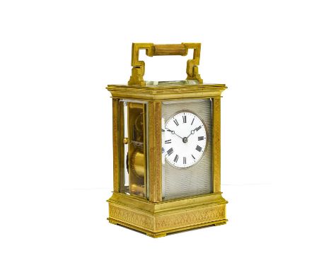 A Brass Striking Carriage Clock, circa 1900, carrying handle, leaf decorated borders, enamel dial with Roman numerals and a s