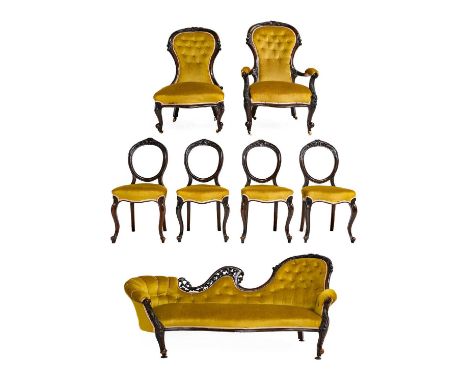 A Victorian Walnut Seven Piece Salon Suite, circa 1870, recovered in buttoned yellow velvet, comprising a sofa with scrolled 