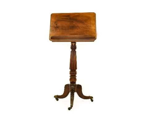 A George IV Carved Mahogany Reading Table, 2nd quarter 19th century, the pivoting top with rest, the ratchet easel support ab