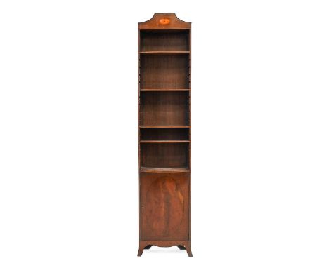 ^ An Edwardian Mahogany, Ebony and Boxwood-Strung Free-Standing Bookcase, of narrow proportions, the moulded top inlaid with 