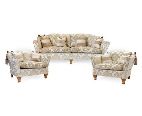 A Trafalgar Pattern Three Piece Suite, modern, comprising a Knoll-style three-seater sofa of curved form with squab cushions,
