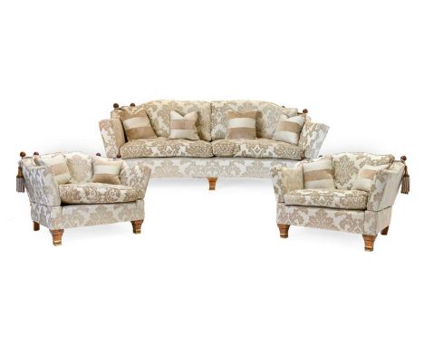 A Trafalgar Pattern Three Piece Suite, modern, comprising a Knoll-style three-seater sofa of curved form with squab cushions,