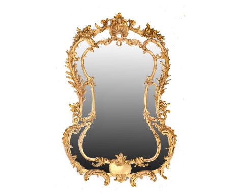 {} A Rococo Style Gilt and Gesso Looking Glass, 19th century, the rockwork frame with vacant cartouche surmounted by a shell 