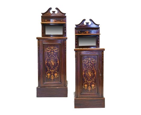 A Pair of Edwardian Mahogany and Marquetry Inlaid Sheraton-Revival Bedside Cabinets, the swan-neck pediments above a small sh