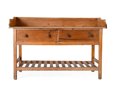 A Victorian Pine Dairy Table, mid 19th century, with three-quarter gallery above two deep drawers, on square form legs joined