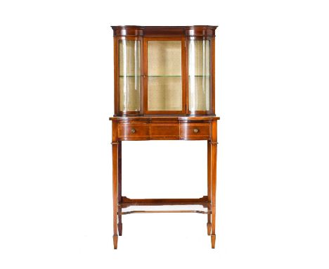 {} An Edwardian Mahogany and Boxwood Strung Lady’s Writing Desk, the upper section with a glazed door and panels enclosing a 