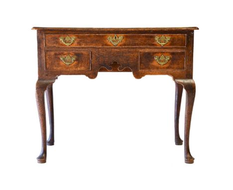 A George III Oak, Mahogany-Crossbanded and Pine-Lined Dressing Table, late 18th century, the crossbanded moulded top above a 