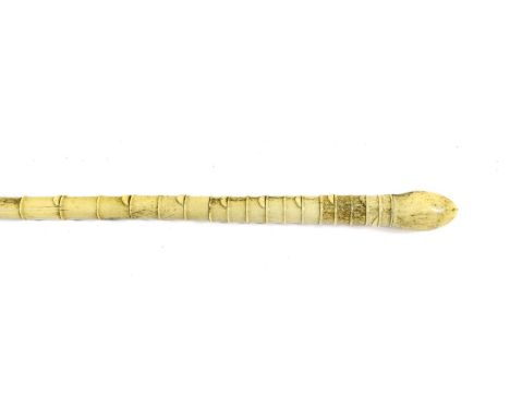 A Whalebone Walking Stick, late 19th century, with ovoid pommel on a tapering ribbed column, 97cm high