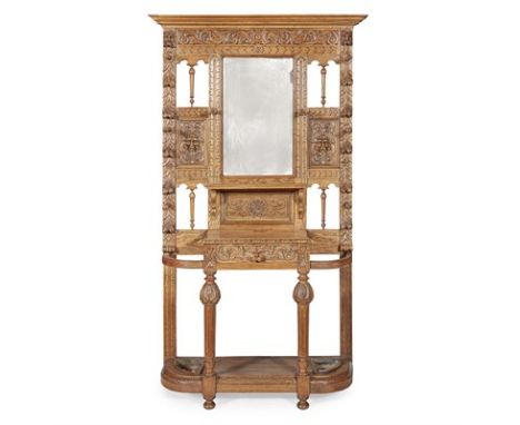 VICTORIAN OAK HALL STAND LATE 19TH CENTURY in the Jacobean style with profusely carved oak surround centred with a mirror pla