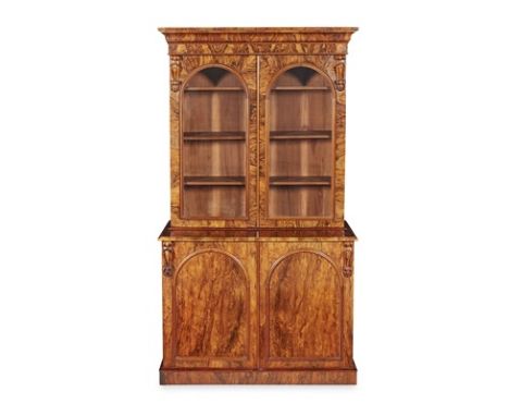 VICTORIAN BURR WALNUT BOOKCASE MID 19TH CENTURY the moulded cornice above a pair of arched glazed doors enclosing adjustable 