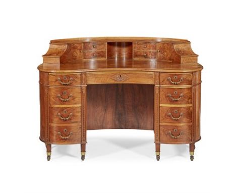 EDWARDIAN WALNUT KIDNEY-SHAPED DESK EARLY 20TH CENTURY the superstructure with drawers, cupboards, and a central recess above