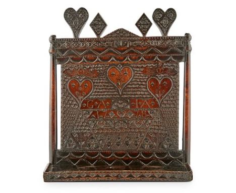 WELSH CARVED FRUITWOOD BETROTHAL WALL SHELF DATED 1778 surmounted by two hearts and two diamonds in relief, above a rectangul