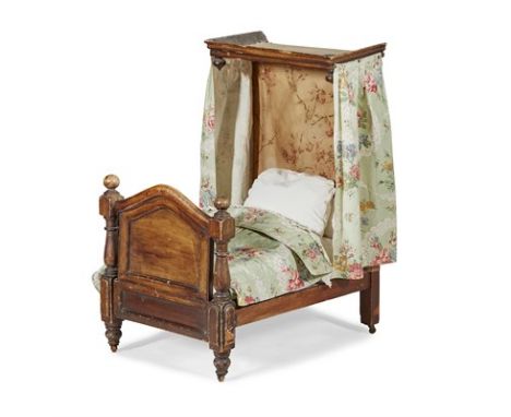 VICTORIAN STAINED BEECH DOLL'S HALF TESTER BED MID 19TH CENTURY with a moulded canopy and arched footboard with knob finials,