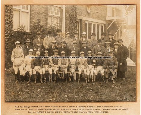 Sepia team photograph of leading jockeys, circa 1920s, group study of 31 jockeys, lined up in three rows and featuring some o