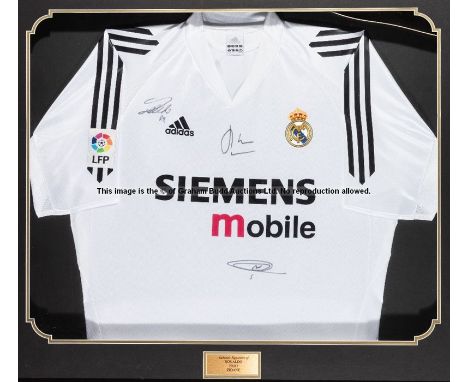 Framed Real Madrid replica home jersey signed by Ronaldo, Zidane and Figo,signed in black marker pen, title plaque, COA taped
