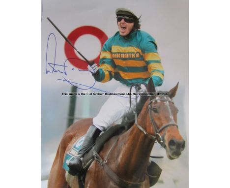 Signed photographic print of the jockey A.P. McCoy,signed in blue marker pen, McCoy depicted at the winning post on “Don’t Pu