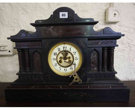 A Large Victorian Black Slate and Marble Mantel Clock, in the Corinthian style, having a French movement, 39cm high