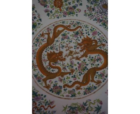 A Large Chinese Famille Rose Charger, Qing Dynasty (Guangxu period 1874-1908) Decorated with two orange polychrome Imperial f