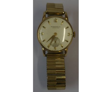 A Vintage 9ct Gold Gents Wristwatch by Wingartens Ltd of London, Having manual wind, baton markers and Arabic numerals to dia