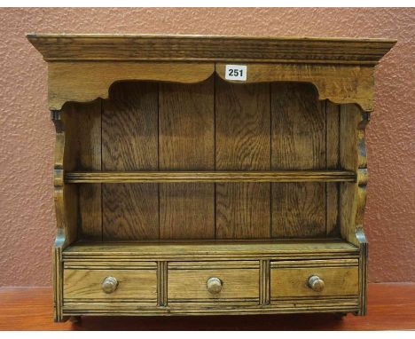 An Oak Wall Hanging Spice Rack, Having an open shelve above three small drawers, 48cm high, 54cm wide, 14cm deep