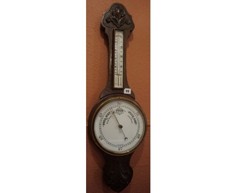 An Oak Banjo Barometer, circa early 20th century, Having a thermometer guage above a white enamel dial, 82cm high 