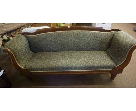 A Victorian Mahogany Sofa, upholstered in later green floral fabric, raised on turned feet, 91cm high, 204cm wide, 59cm deep 