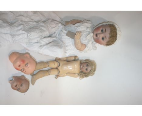 SIMON& HALBIG FOR KAMMER & REINHARDT with weighted blue eyes, open mouth and pierced ears. Also with a large bisque head doll