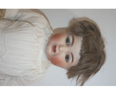 SIMON & HALBIG FOR KAMMER & REINHARDT DOLL a large doll with weighted blue flirty eyes, open mouth and bent limb body. Impres