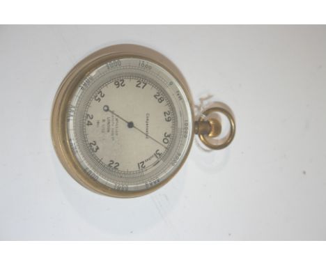 LARGE POCKET BAROMETER - T WHEELER a large pocket barometer/altimeter, with a silvered dial and brass case. Made by T Wheeler