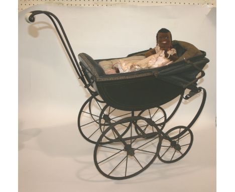 VINTAGE DOLLS PRAM with a ceramic and metal handle, a metal frame and button back upholstery. Also with a Norah Wellings styl
