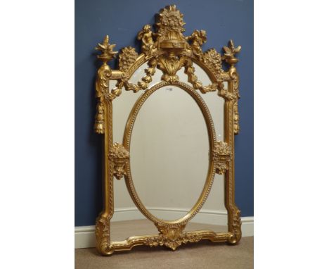 Ornate gilt finish wall mirror, oval centre, decorated with foliage and cherubs, W90cm, H135cm