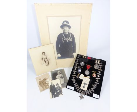 St. John's Ambulance - hallmarked silver chain with 26 year labels and 16 pendants (1908-1932) and other regalia issued to 10