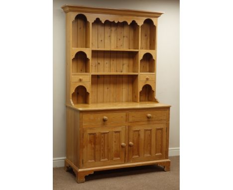 Waxed pine kitchen dresser, two drawers and two cupboards, raised two heights plate rack with spice drawers. W131cm, H201cm, 