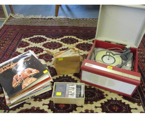 A Decca RP2190 Monarch record deck, a selection of LP records and 45rpm singles to include Shirley Bassey and Scott Mackenzie