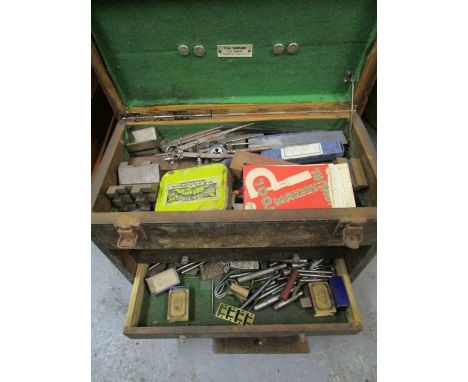 A small engineering tool chest, with an assortment of tools 