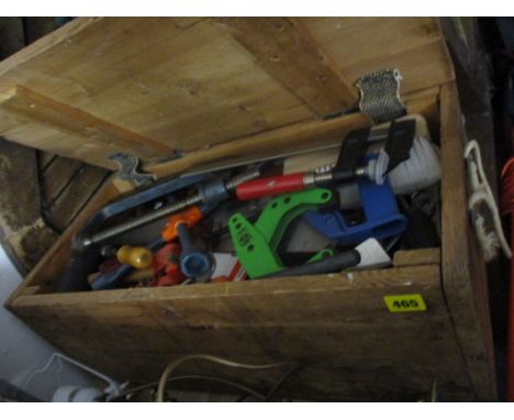 A mid 20th century pine tool chest containing various tools, clamps, saws and spanners 