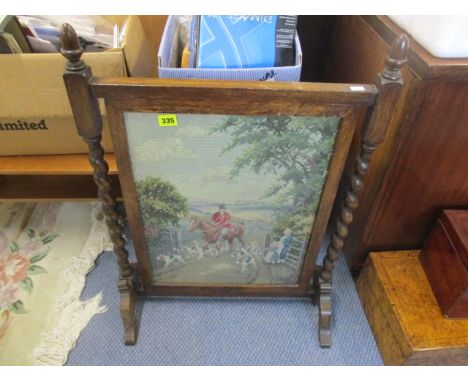 An early 20th century oak framed tapestry fire screen 