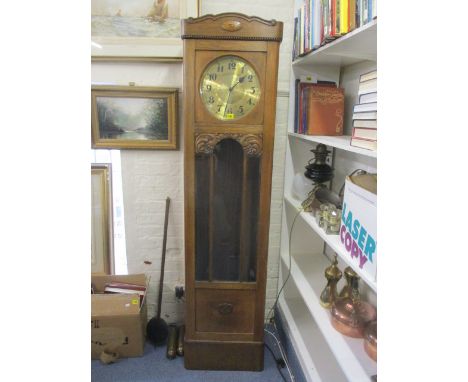 An early 20th century oak long case clock 