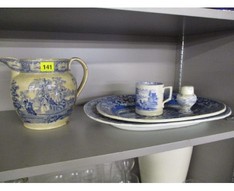 Two Victorian blue and white meat dishes, a Victorian jug, a mug and a pottery pepperette or sander 