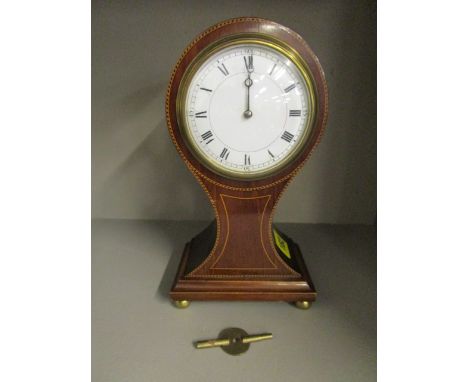An Edwardian inlaid mahogany balloon cased mantle clock with white enamelled Roman dial, 3 3/8", housing a French movement, s