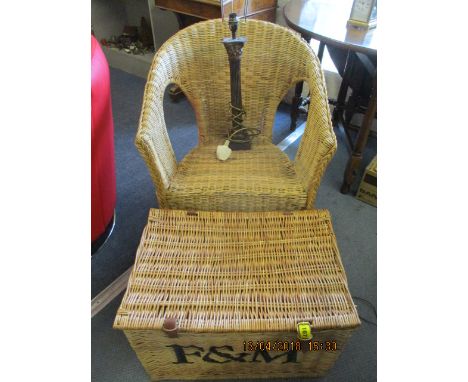 A modern Fortnum & Mason hamper, together with a modern wicker armchair and a modern metal table lamp in a column form 