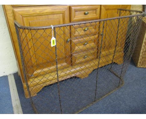 An early 20th century brass and wire mesh nursery fireguard 