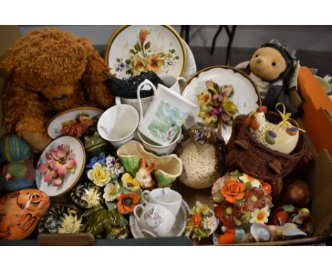 An eclectic mix of fuana ware, teddy bear, hand painted stones etc